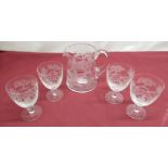 Glass water set, the jug and four goblets each decorated with a hunting scene and signed W G Webb,