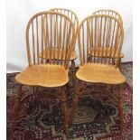 Set of four Treske Furniture elm Windsor type chairs, hoop and stick backs and shaped seats on