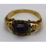 18ct yellow gold memorial ring set with cabochon purple stone on snake band, engraved inside "John