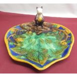 Majolica leaf shaped moulded dish, modelled with a squirrel holding a nut on a branch, W25cm D28cm