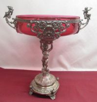 WMF silver plated table centre, the circular top with cranberry glass liner and figural handles,