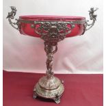 WMF silver plated table centre, the circular top with cranberry glass liner and figural handles,