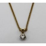 18ct solitaire round cut diamond pendant on 18ct yellow gold chain, both stamped 750, L26cm, 7.3g