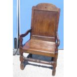 C18th and later oak Wainscot type chair, arched panelled back and solid