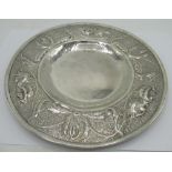 Arts & Crafts silver circular Alms dish, the border relief decorated with foliage on a matted