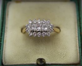 18ct yellow gold cluster ring, the three central princess cut diamonds surrounded by fourteen