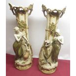 Pair of large Royal Dux figural vases modelled as female figures by naturalistic tree trunks with