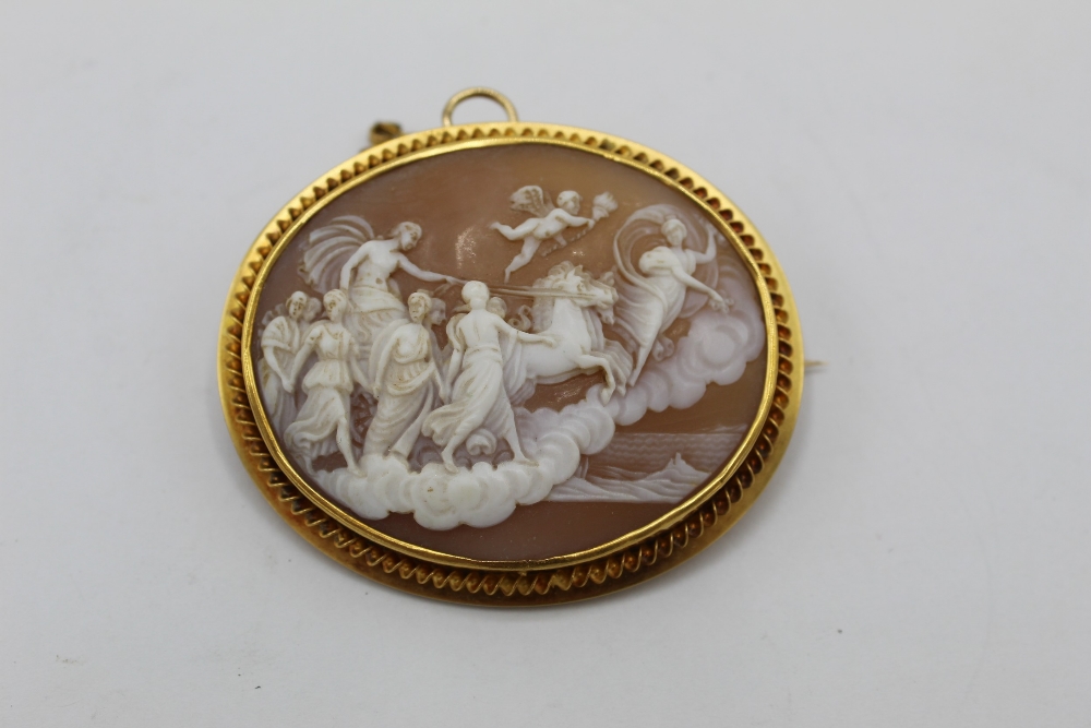 WITHDRAWN - C20th oval shell cameo brooch, carved as Diana the Huntress, in C scroll unmarked yellow - Image 2 of 3