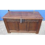 C18th oak coffer, hinged top with moulded edge, three panel front with