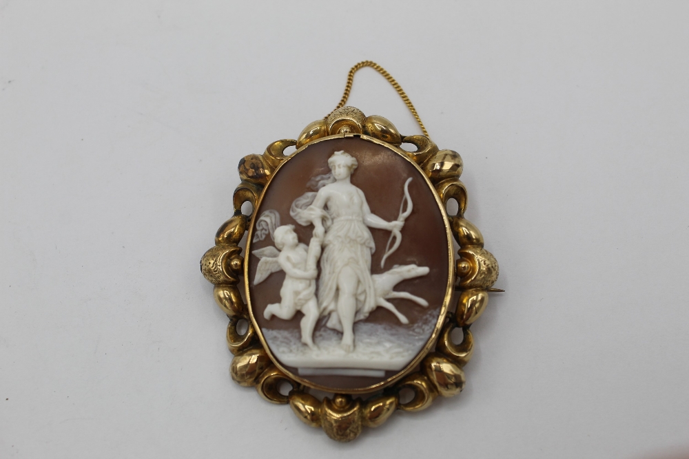 WITHDRAWN - C20th oval shell cameo brooch, carved as Diana the Huntress, in C scroll unmarked yellow - Image 3 of 3