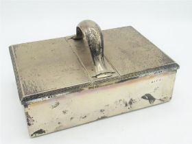 Geo.V Art Deco hallmarked silver Treasury style cigar box, with strap work handle, engine turned