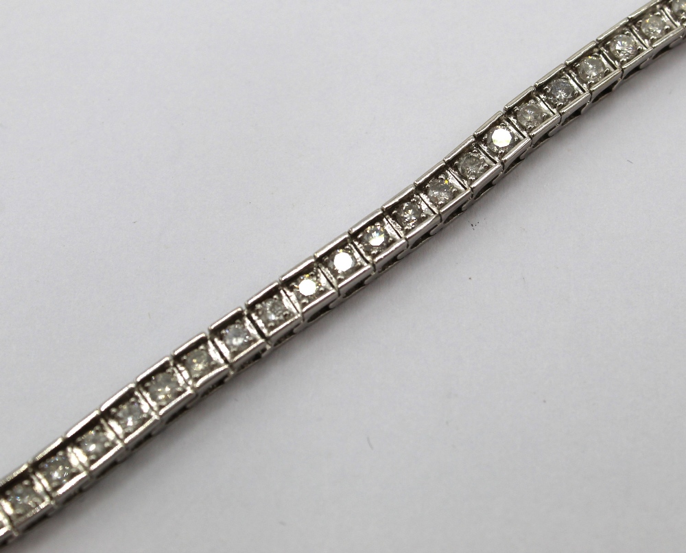 14ct white gold tennis bracelet set with fifty three brilliant cut diamonds, L19cm, stamped 14k, - Image 2 of 2