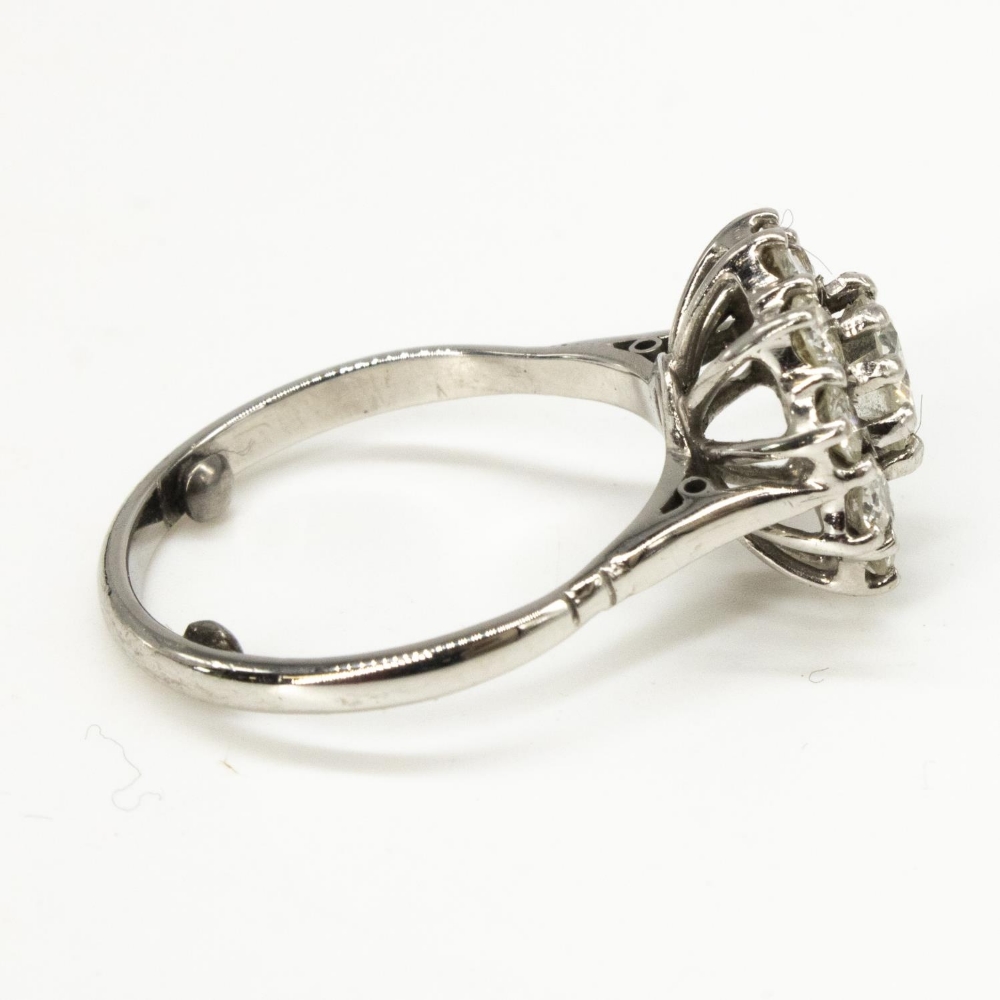 Diamond daisy ring, round cut claw set central diamond surrounded by ten smaller claw set round - Image 2 of 2