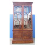 Large Victorian mahogany bookcase, moulded cornice with fluted frieze, two astragal glazed doors