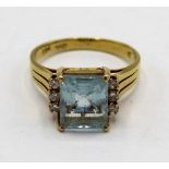 Art Deco style 18ct gold ring, set with a square aquamarine of approx 3.57 and 6 .16 diamonds,