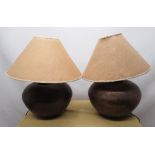 Pair of Indian style table lamps, globular hammered metal bodies with