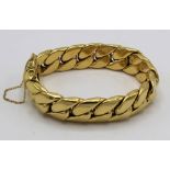 Kutchinski 18ct gold curb chain bracelet with tongue and groove fastener, twin catches and safety