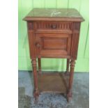 Early C20th marble top French Empire style bedside cabinet, panelled door and frieze drawer on