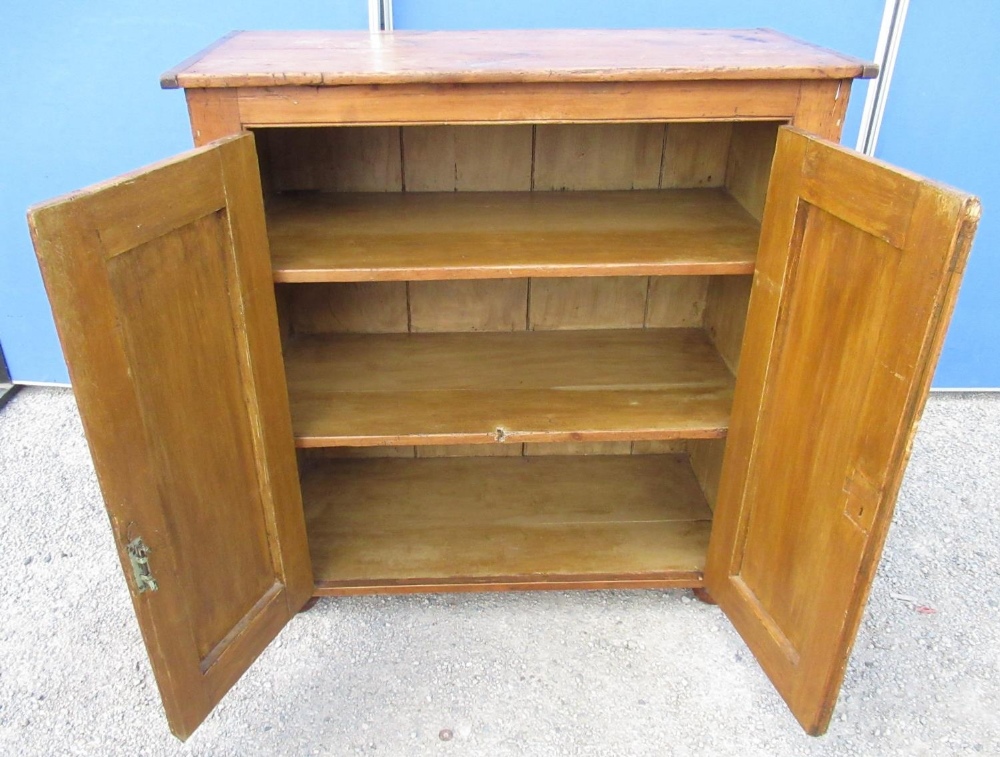 Waxed pine kitchen cupboard, moulded top and two raised panel doors, on bun - Image 2 of 2