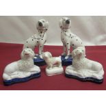 Pair of small Staffordshire Spaniels, another pair with black spotted markings, gilt collars and