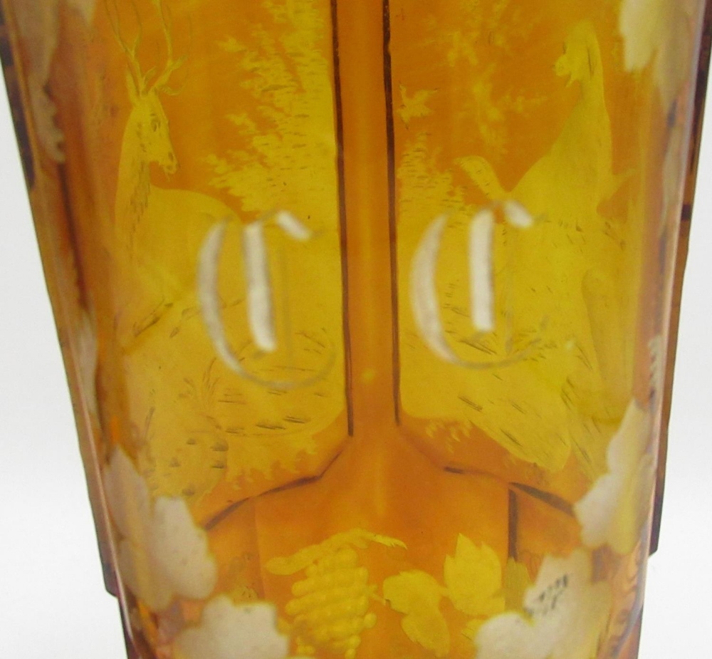 Pair of Bohemian amber glass Hunting goblets, tapering bowls etched in relief panels with Stag, - Image 2 of 4
