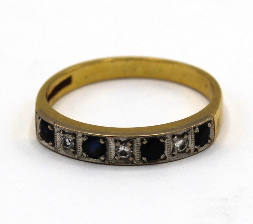 18ct yellow gold half hoop eternity ring set with three diamonds and four sapphires, size P, 3.3g