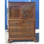 Geo.III style mahogany cupboard on chest, two curl veneer panel doors above three long drawers on