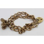 9ct gold double chain bracelet, with 9ct gold mail coach charm and padlock clasp, 35.5g