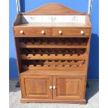 Waxed pine kitchen cabinet, arched tiled back above two drawers, 24