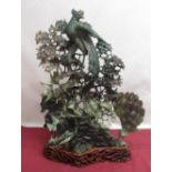 Large Chinese carved jadeite tableau of exotic birds, pheasants and cranes within profuse foliage,