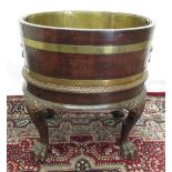 Geo.III style coopered oval oak wine cooler on carved mahogany stand, gadrooned base with hairy
