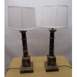 Pair of Regency style black Chinoiserie decorated table lamps, tapering columns on square plinths