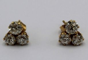 pair of 18ct yellow gold three stone diamond cluster earrings, with butterfly backs, stamped 750,