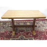 Alan Grainger Acorn Industries of Brandsby - an oak coffee table, adzed rectangular top on solid end
