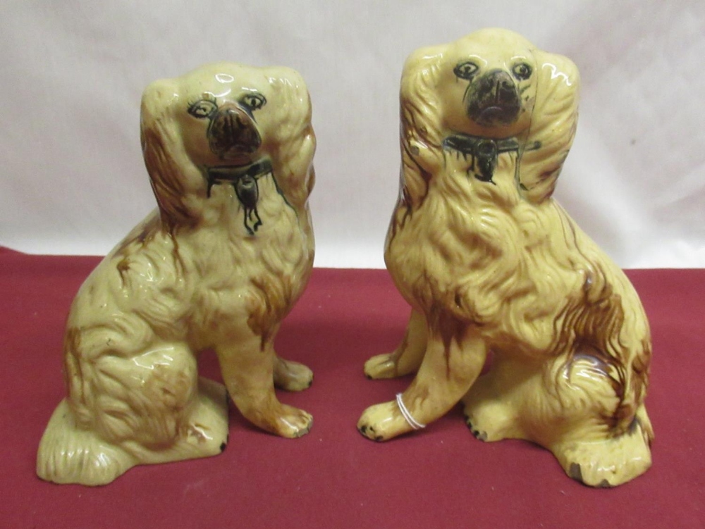 Pair of C19th Staffordshire brown glazed hollow models of Spaniels with black muzzles and collars,