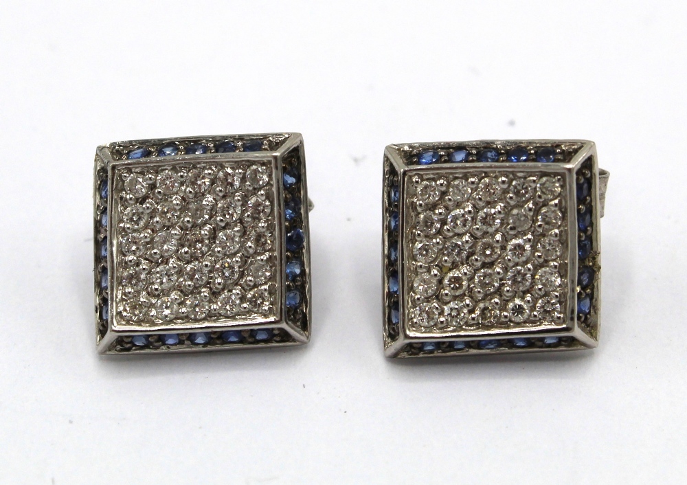 Pair of 14ct white gold pave set sapphire and diamond earrings with butterfly backs, stamped 14k