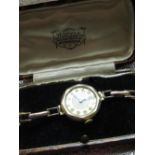 Swiss ladies 9ct gold wristwatch, two tone silvered Arabic dial, two piece case hallmarked Chester