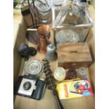 Scrolled wrought metal tea light, glass lantern, cast metal Lion money box, brass inlaid hardwood