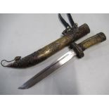 Eastern dagger with 8 1/2" blade with bronze grip and sheath, decorated with various figures and