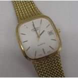 Rotary quartz wristwatch with date, signed champagne covered dial with baton hour markers, gold