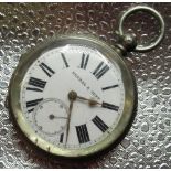 Kendal & Dent silver key wound open faced pocket watch, white enamel Roman dial with rail track