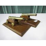 Pair of scale model cannons with 6" barrels on wooden plinths