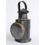 A large railway lamp with lockable rotating lamp mechanism, height to handle top 34cm. No makers