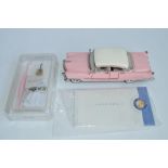 A Franklin Mint 1/24 Elvis Presley 1955 Pink Cadillac diecast model car, with box, paperwork and all