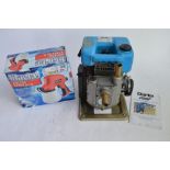 A Clarke CD1 1 inch petrol driven water pump with instructions and a Clarke airless spraygun (