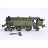 A vintage pre-war Hornby Series O gauge clockwork 4-4-2 tank locomotive in GWR livery, No 2221