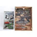 A collection of OO gauge train parts, motors, spare wheels etc. Includes 2 heavily weathered