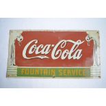 An enamelled steel plate Coca-Cola "Fountain Service" advertising sign. W69.7xH35.6cm