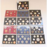 Thirteen UK coin and date sets in perspex cases (some incomplete)