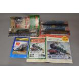 Collection of magazine syndicated static train models and tin poster, 1954 Standard 4MT class
